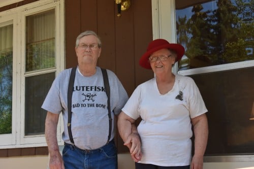 My parents, looking cute in their funny shirts. Dad's disses lutefisk, which my mom thought was untrue. She wore one of Dad's old worn and torn t-shirts. The tear in the back looked like the perfect place for a tattoo.