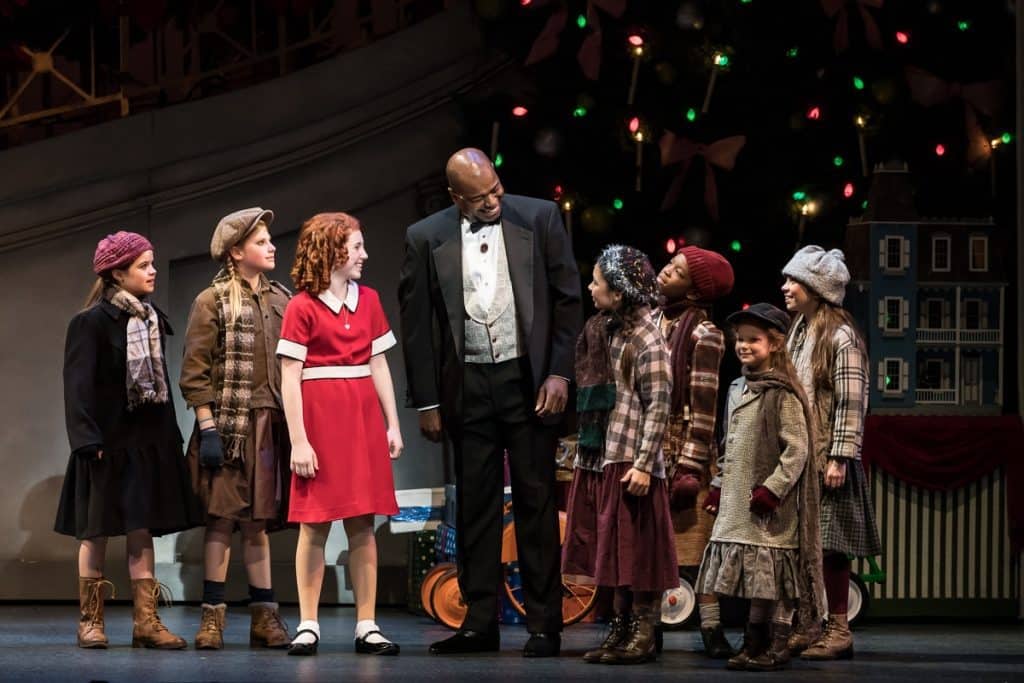 Lance Roberts as Daddy Warbucks, Carly Gendell as Annie, and the "Little Girls" in Annie at the Ordway in St. Paul, MN through Dec. 31, 2017. Photo by Rich Ryan